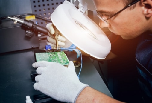technician fixing circuit board